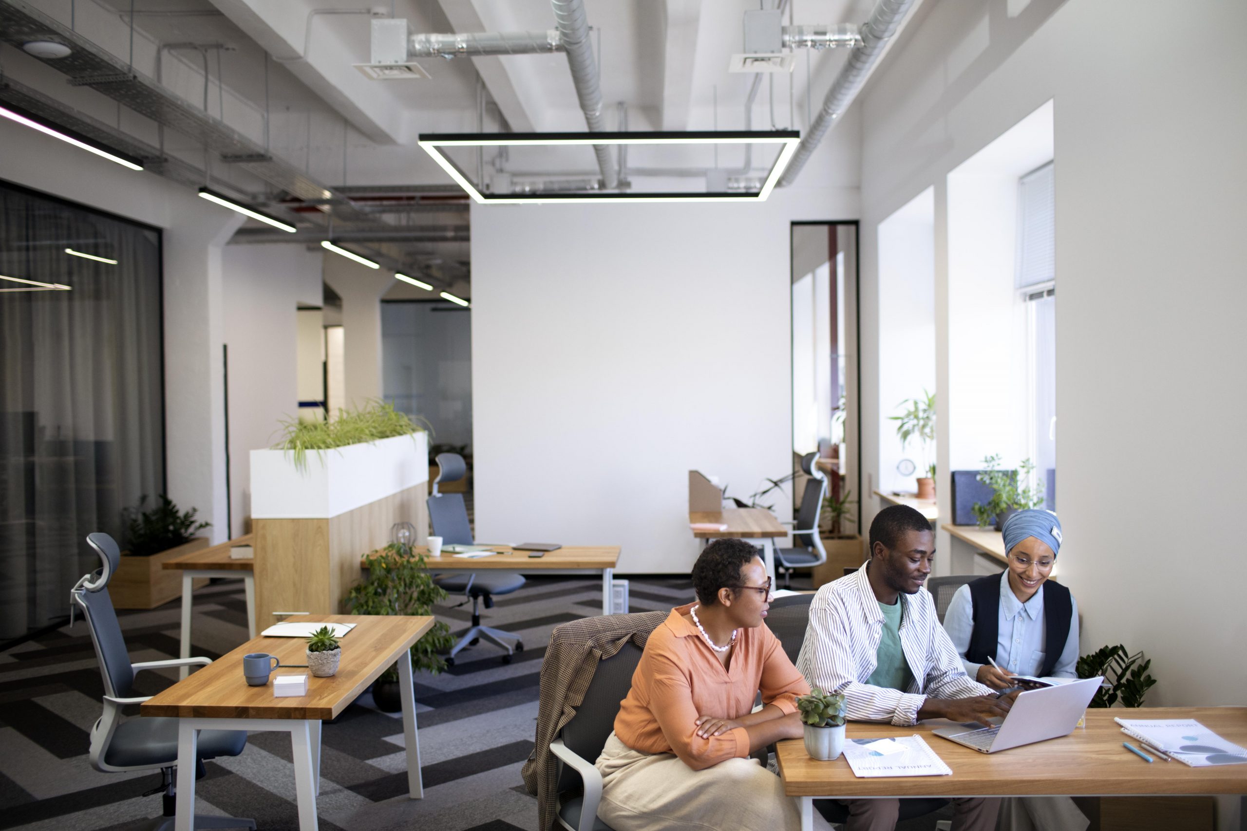 male employee getting used his new office job along with female colleagues